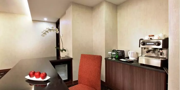 Spacious suite with ocean view adjoined living and dining area in a modern hotel in kupang