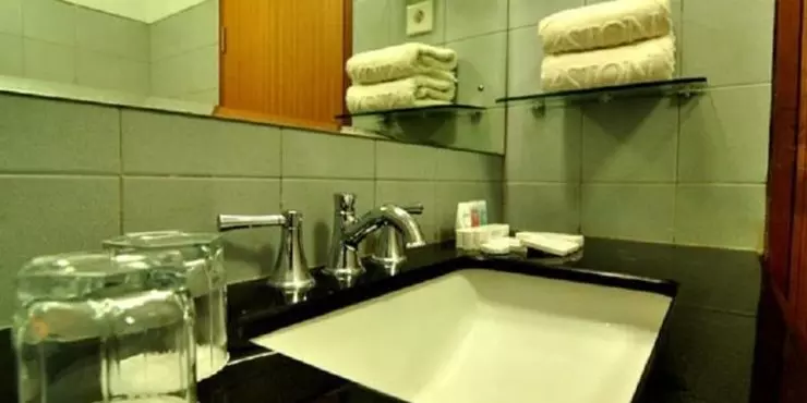Pamper yourself in bathroom with rain shower and full of amenities based on ASTON standard