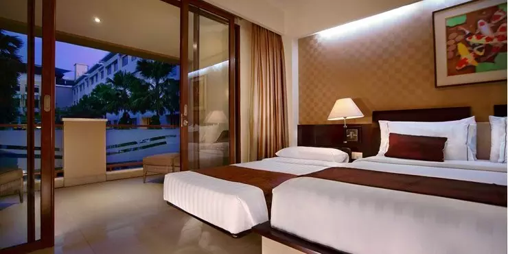 spacious room with complete modern amenities for holiday with family in kuta bali