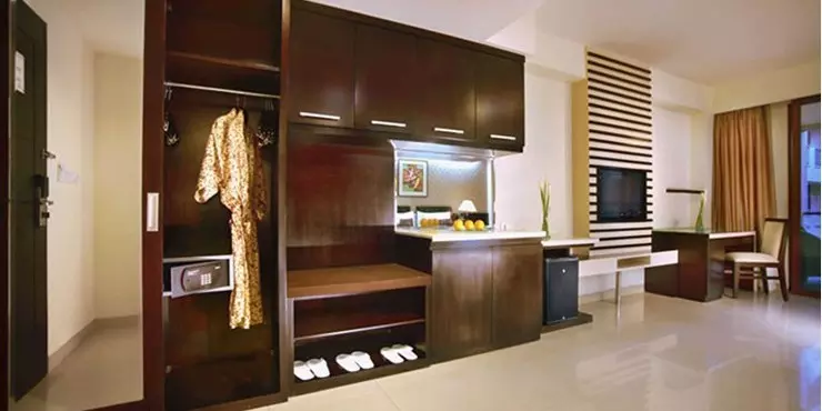 spacious room with complete modern amenities for holiday with family in kuta bali