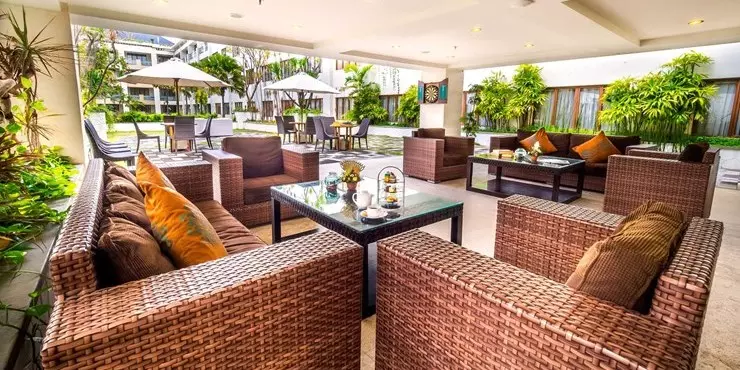 Semi-outdoor entertainment lounge overlooking the swimming pool view in Kuta bali