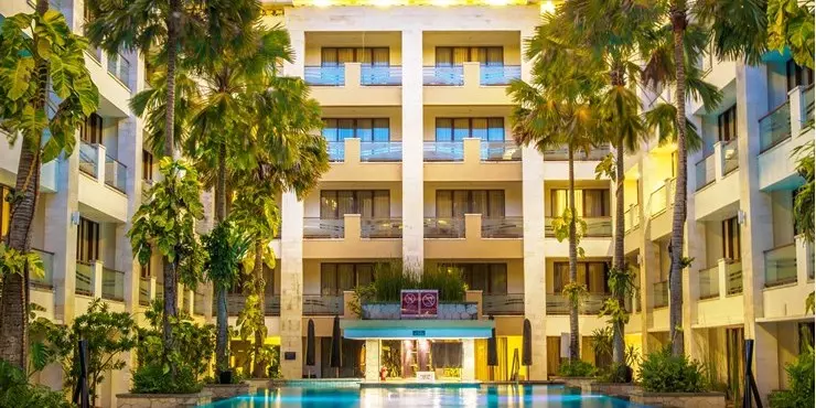 A tropical setting swimming pool chill out and enjoy the clear blue sky and sunny day in kuta bali