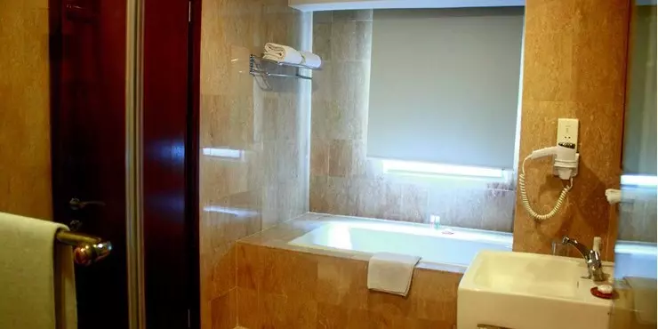 Modern room with classic design and adjoined living area in manado