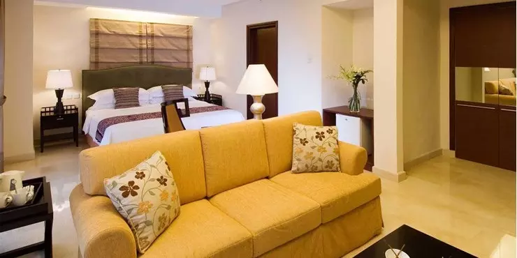 Modern room for VIP guest with classic design and adjoined living area in manado