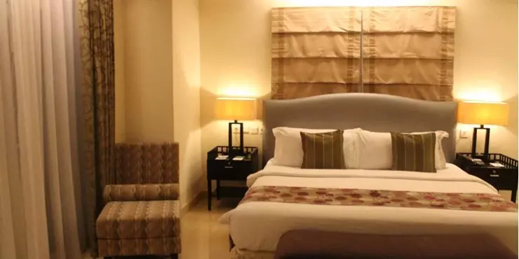Modern room for VIP guest with classic design and adjoined living area in manado